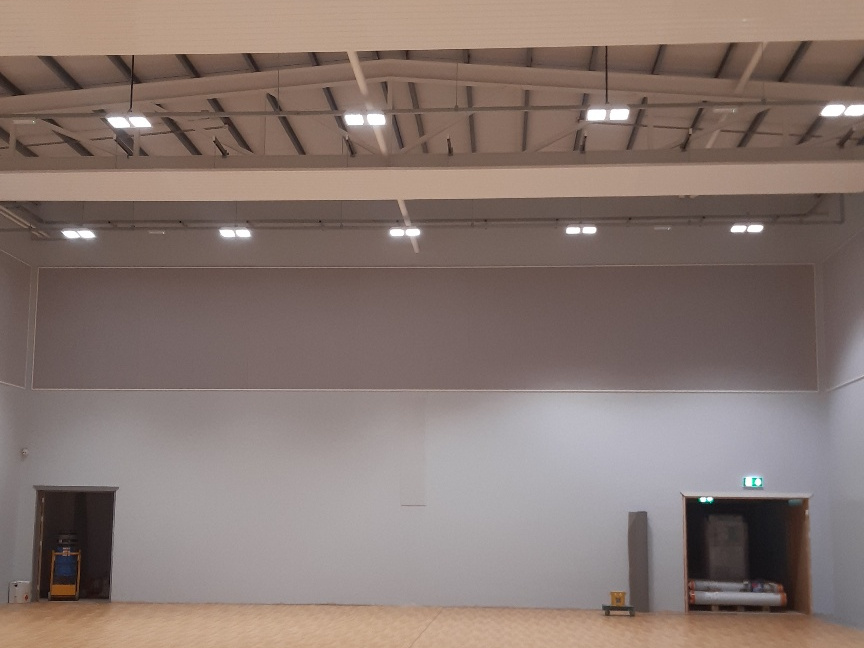 Sound absorbing acoustic panels in community centre hall.